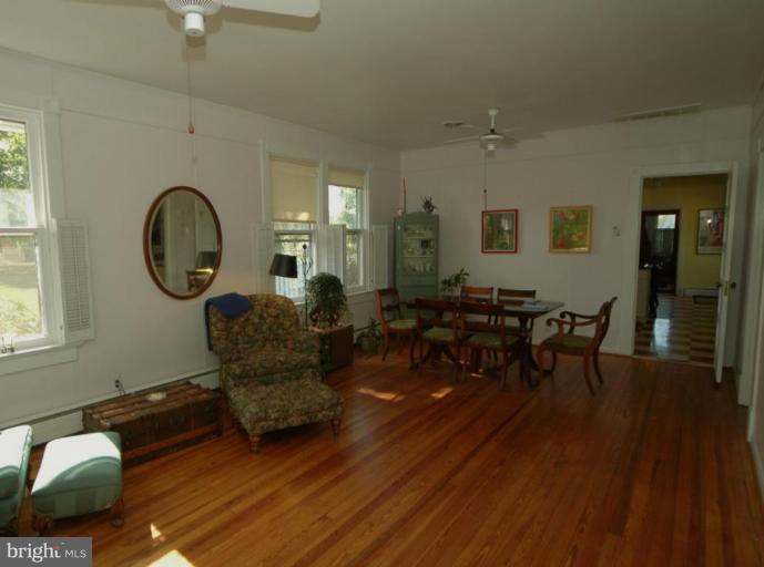 113 Morven Park Road Northwest Leesburg, VA 20176 - Photo 13 of 16 a living room with furniture and wooden floor