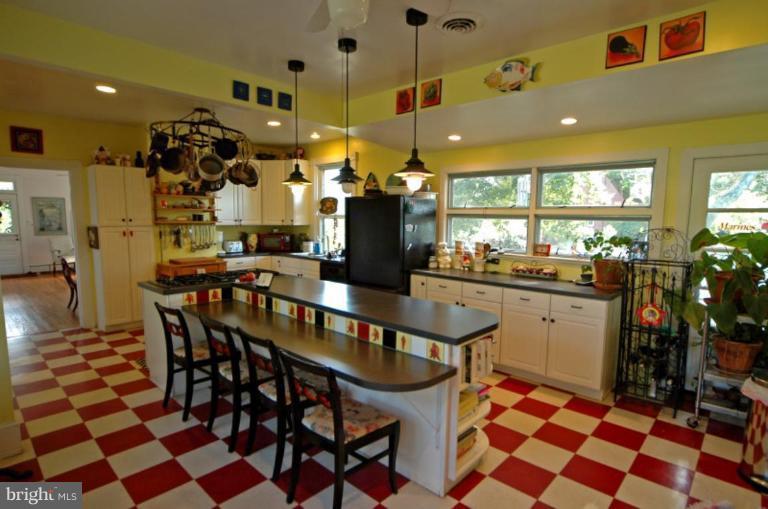 113 Morven Park Road Northwest Leesburg, VA 20176 - Photo 14 of 16 a kitchen with a dining table and chairs