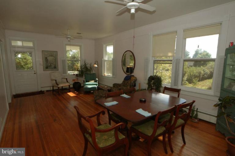 113 Morven Park Road Northwest Leesburg, VA 20176 - Photo 15 of 16 a view of a dining room with furniture and wooden floor