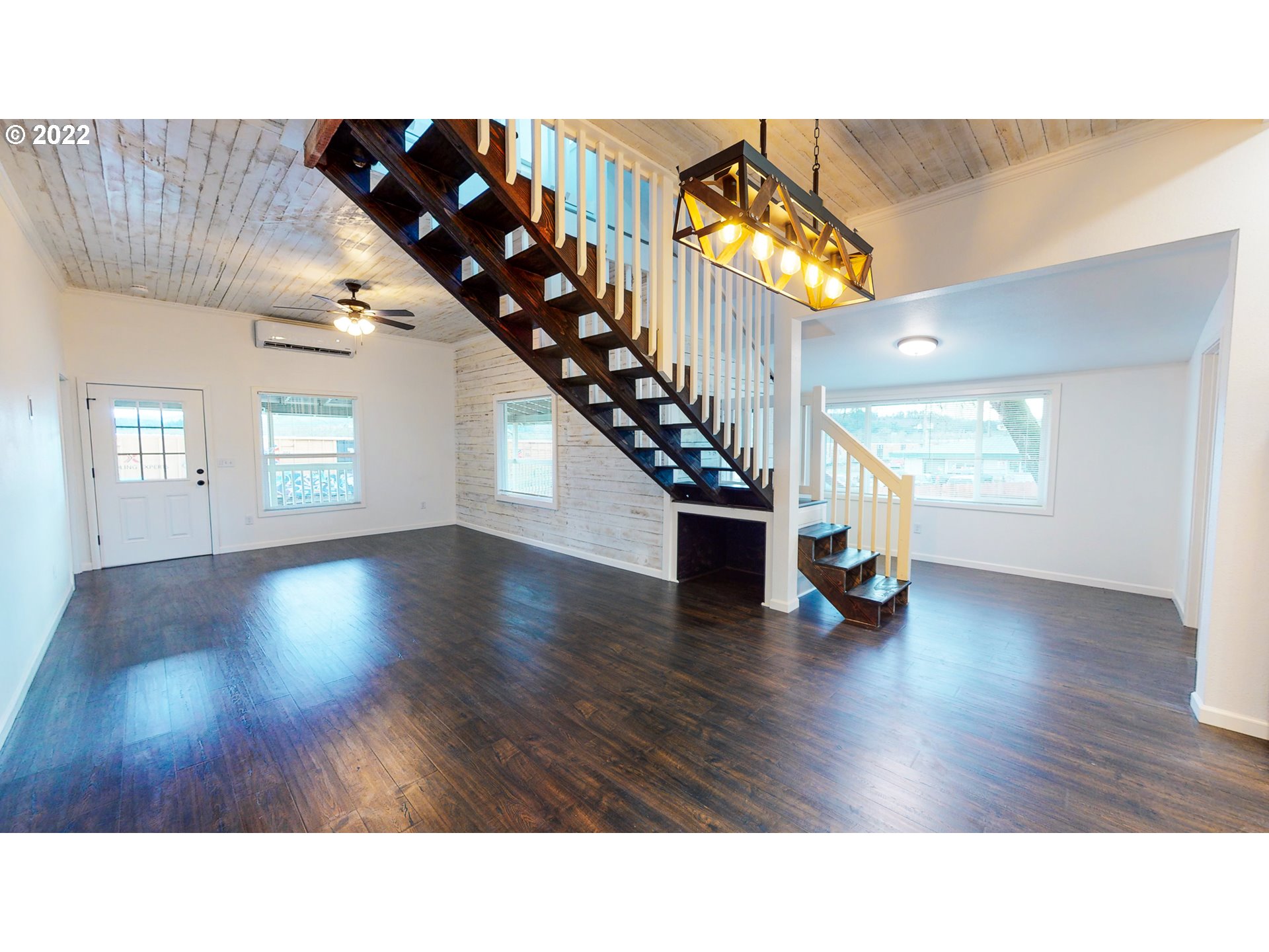 2600 Eagle Valley Road Yoncalla, OR 97499 - Photo 2 of 27 a open hall with stairs and wooden floor