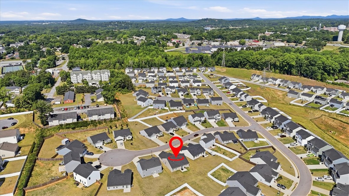 117 Alice Court Easley, SC 29642 - Photo 22 of 26 An aerial panorama showcases a burgeoning residential neighborhood nestled amidst verdant landscapes, offering tranquil living.