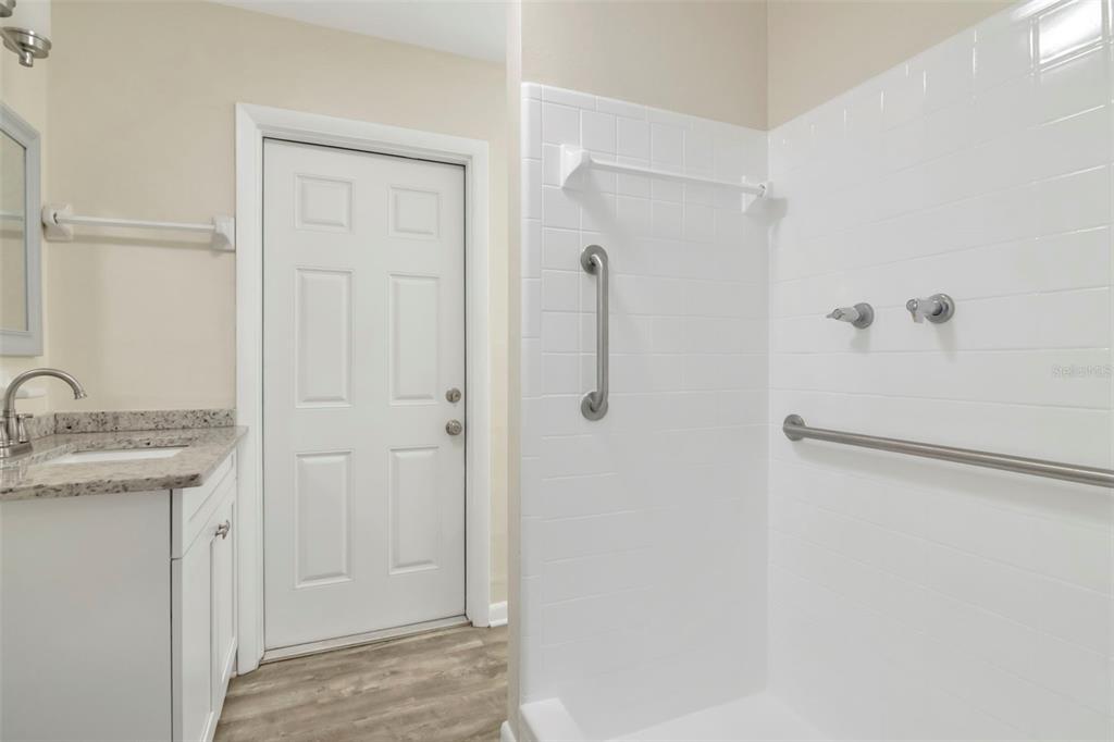 126 Kingsway Road Brandon, FL 33510 - Photo 32 of 42 a view of a bathroom with a shower and vanity