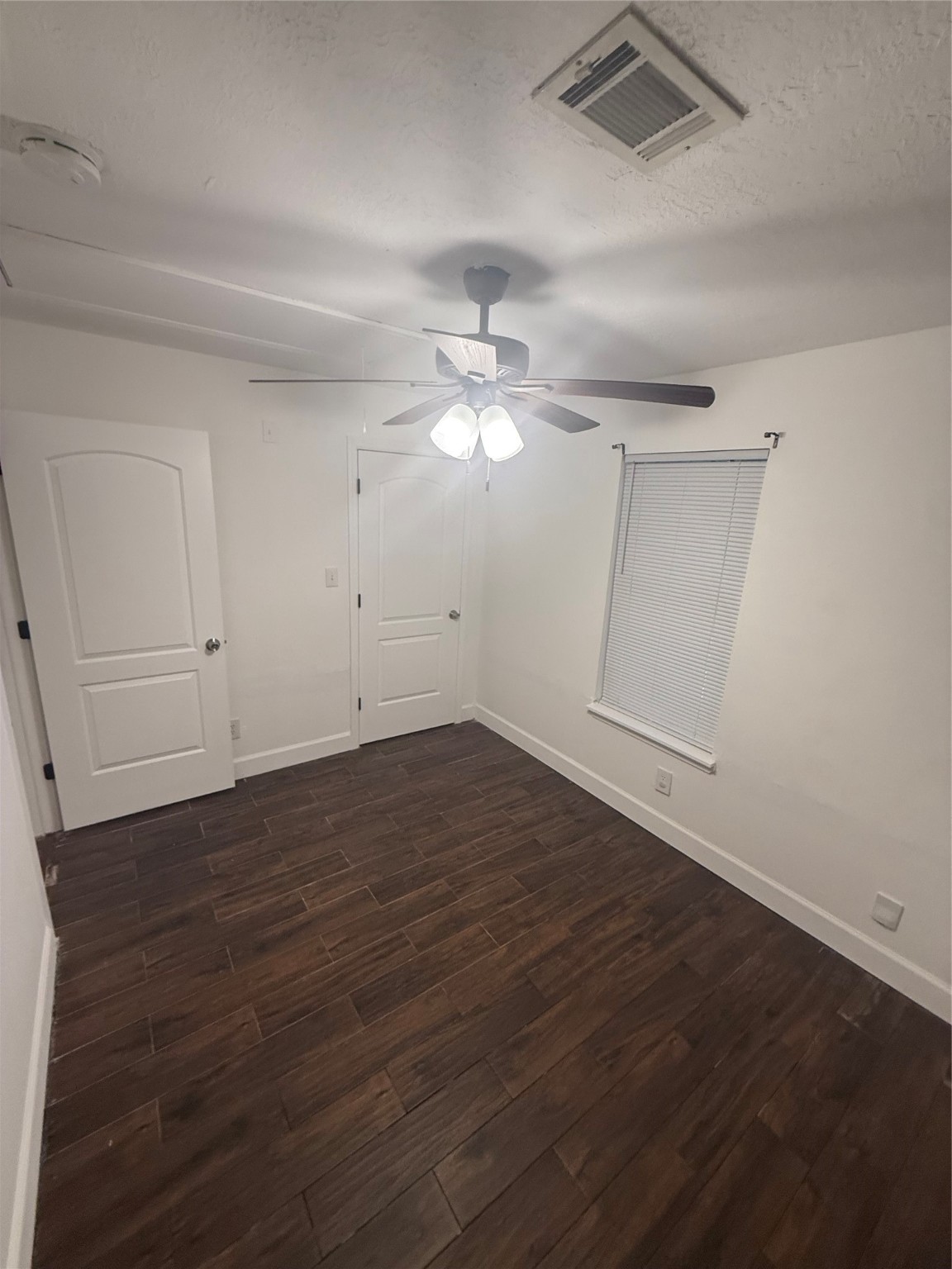 919 Lovett Street Tomball, TX 77375 - Photo 13 of 21 wooden floor in an empty room
