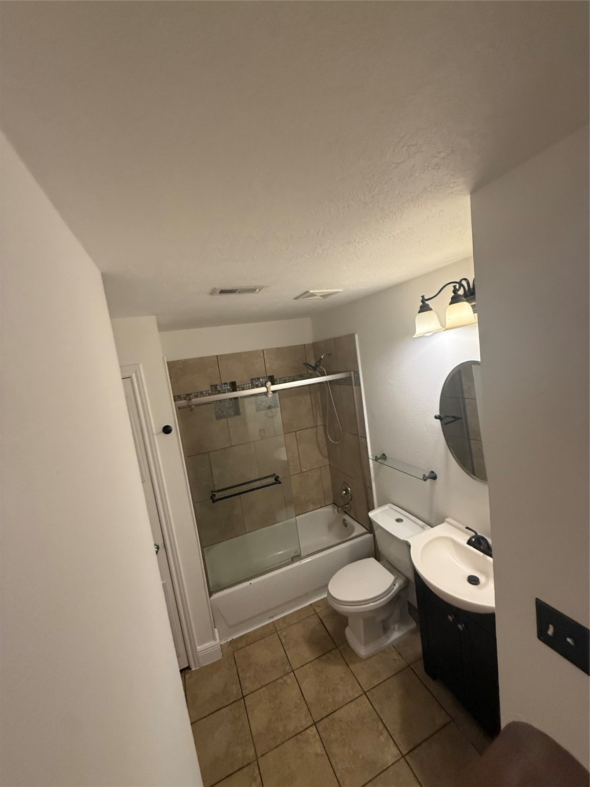 919 Lovett Street Tomball, TX 77375 - Photo 14 of 21 a bathroom with a toilet and a shower