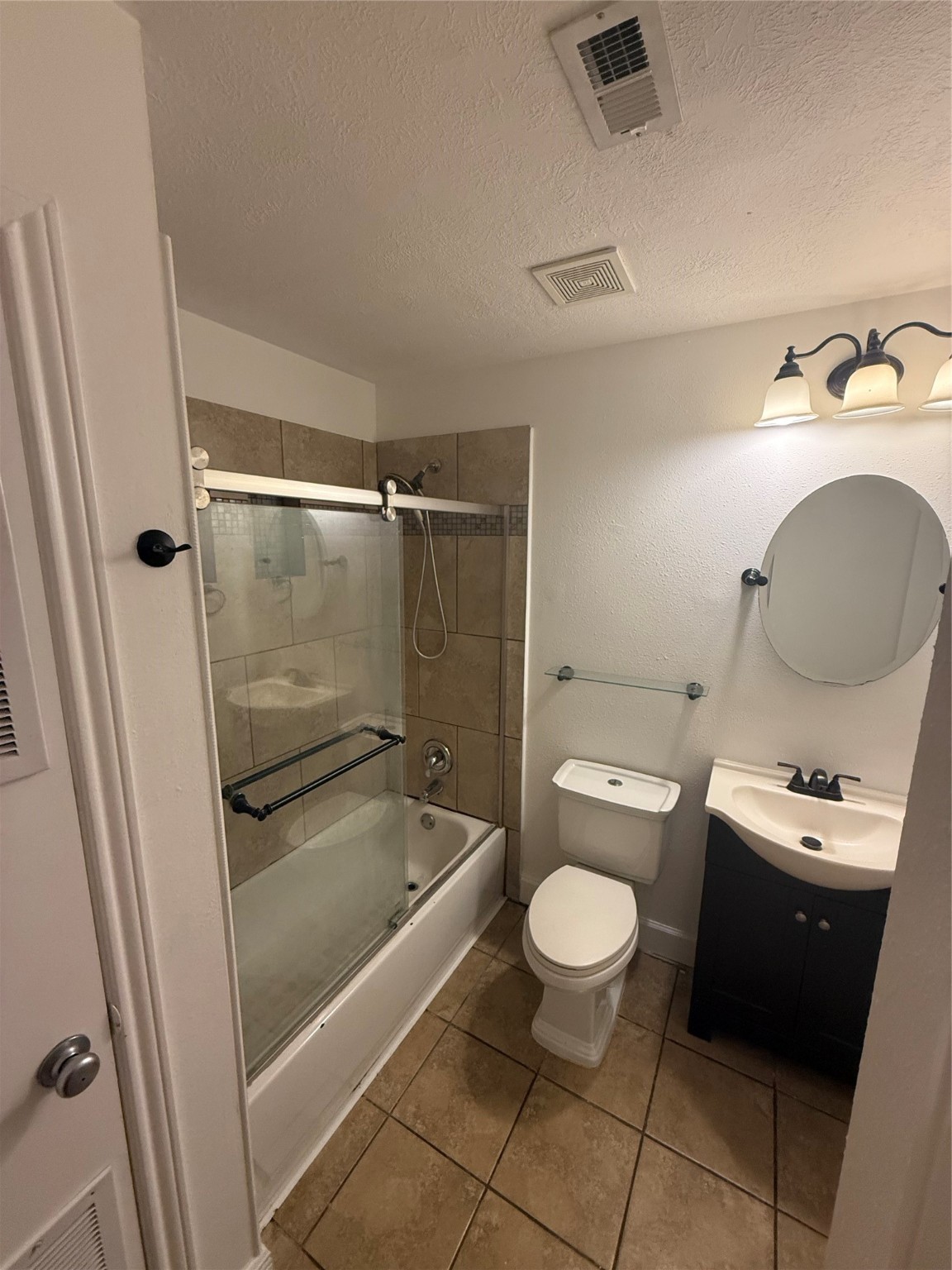 919 Lovett Street Tomball, TX 77375 - Photo 15 of 21 a bathroom with a sink a toilet and a shower