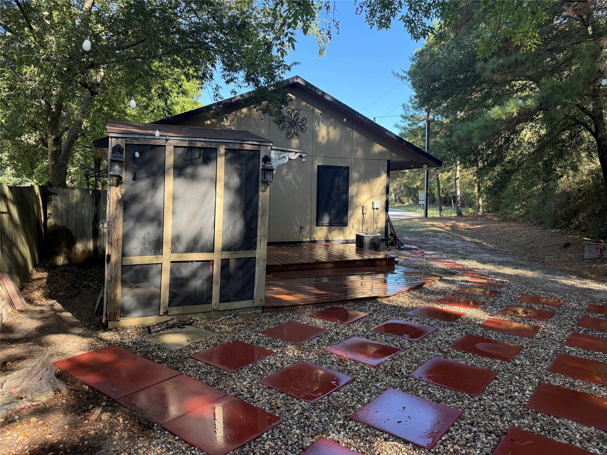 919 Lovett Street Tomball, TX 77375 - Photo 16 of 21 a backyard of a house with barbeque oven fire pit and outdoor seating