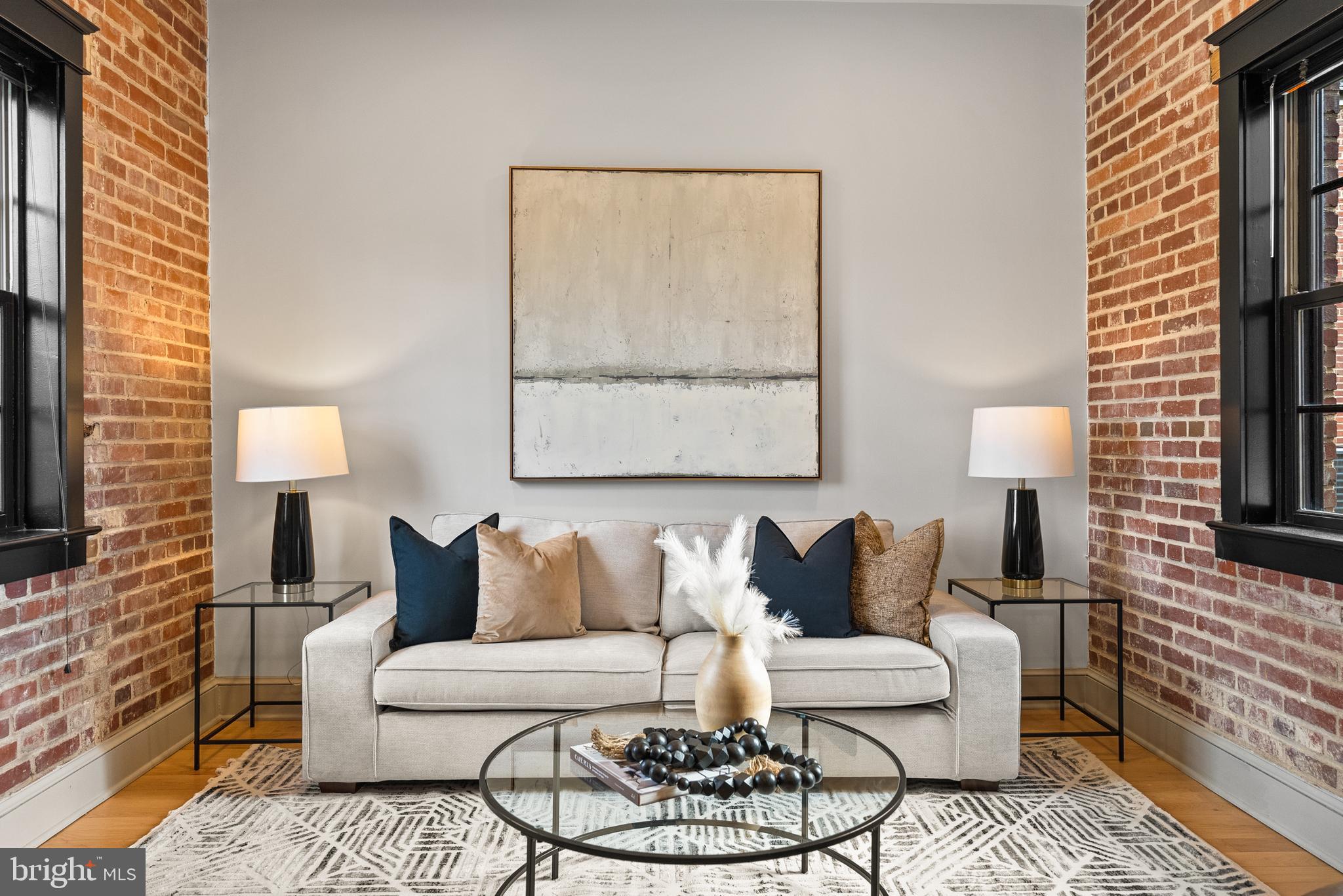 9071 Power House Road, Unit 102 Lorton, VA 22079 - Photo 1 of 53 a living room with furniture and a lamp