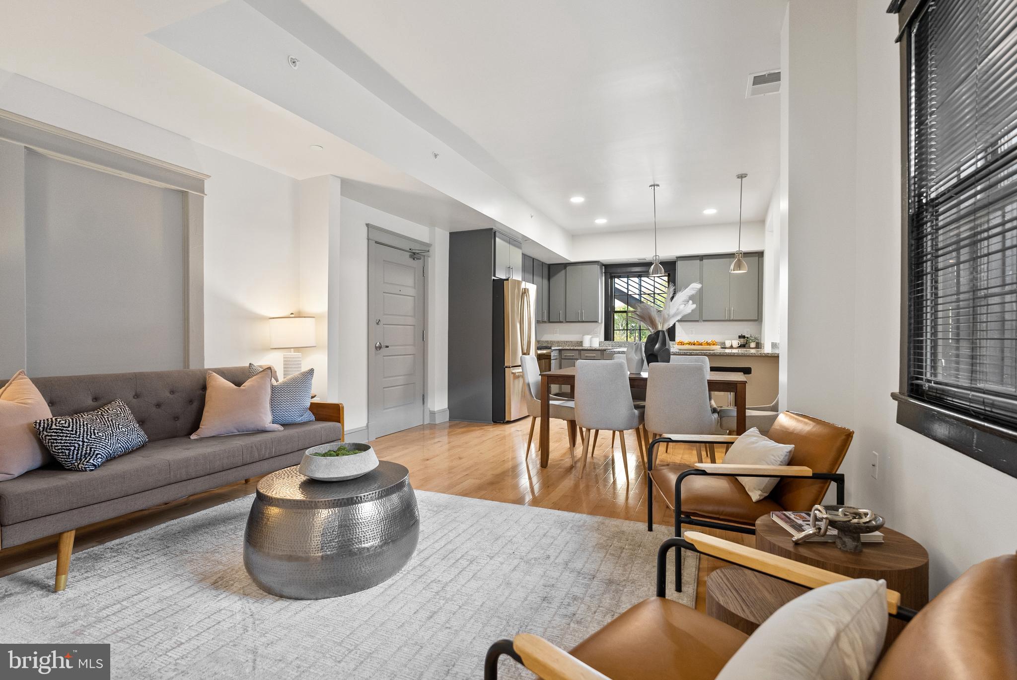 9071 Power House Road, Unit 102 Lorton, VA 22079 - Photo 21 of 53 a living room with furniture and a large window