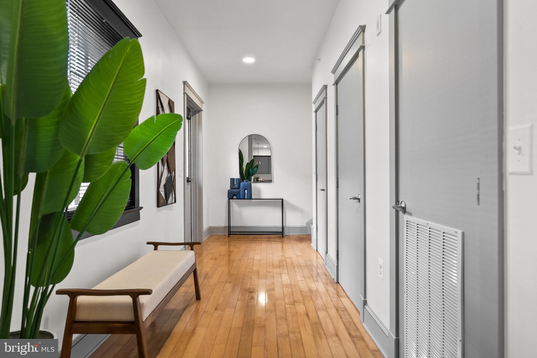9071 Power House Road, Unit 102 Lorton, VA 22079 - Photo 23 of 53 a view of a hallway with furniture and a entryway