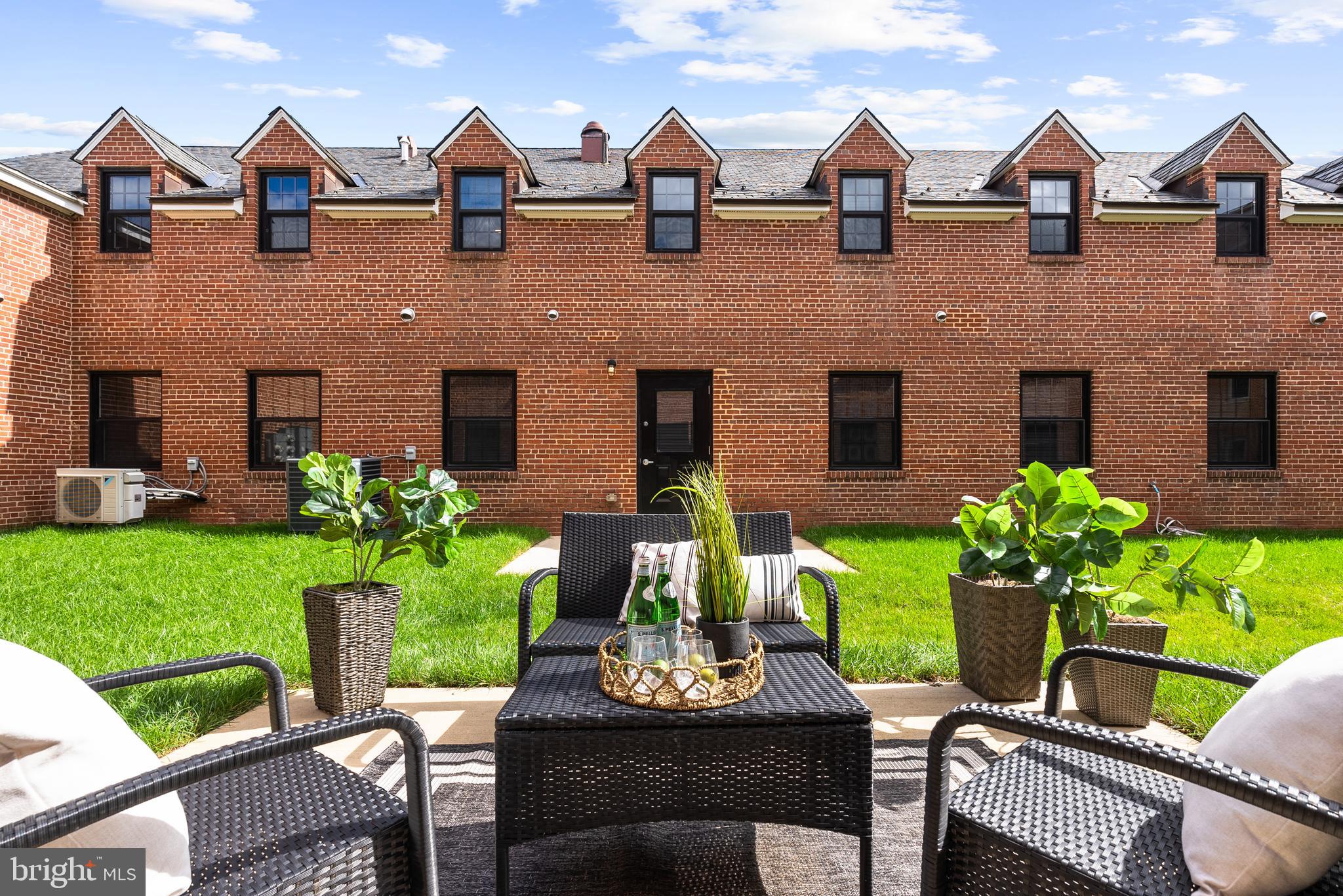 9071 Power House Road, Unit 102 Lorton, VA 22079 - Photo 25 of 53 a view of a house with a yard and patio