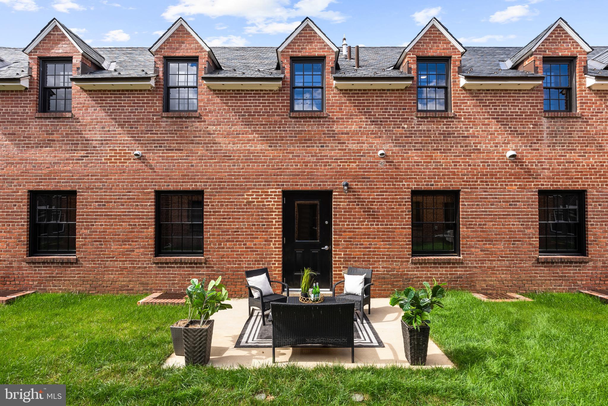 9071 Power House Road, Unit 102 Lorton, VA 22079 - Photo 26 of 53 a front view of a house with garden