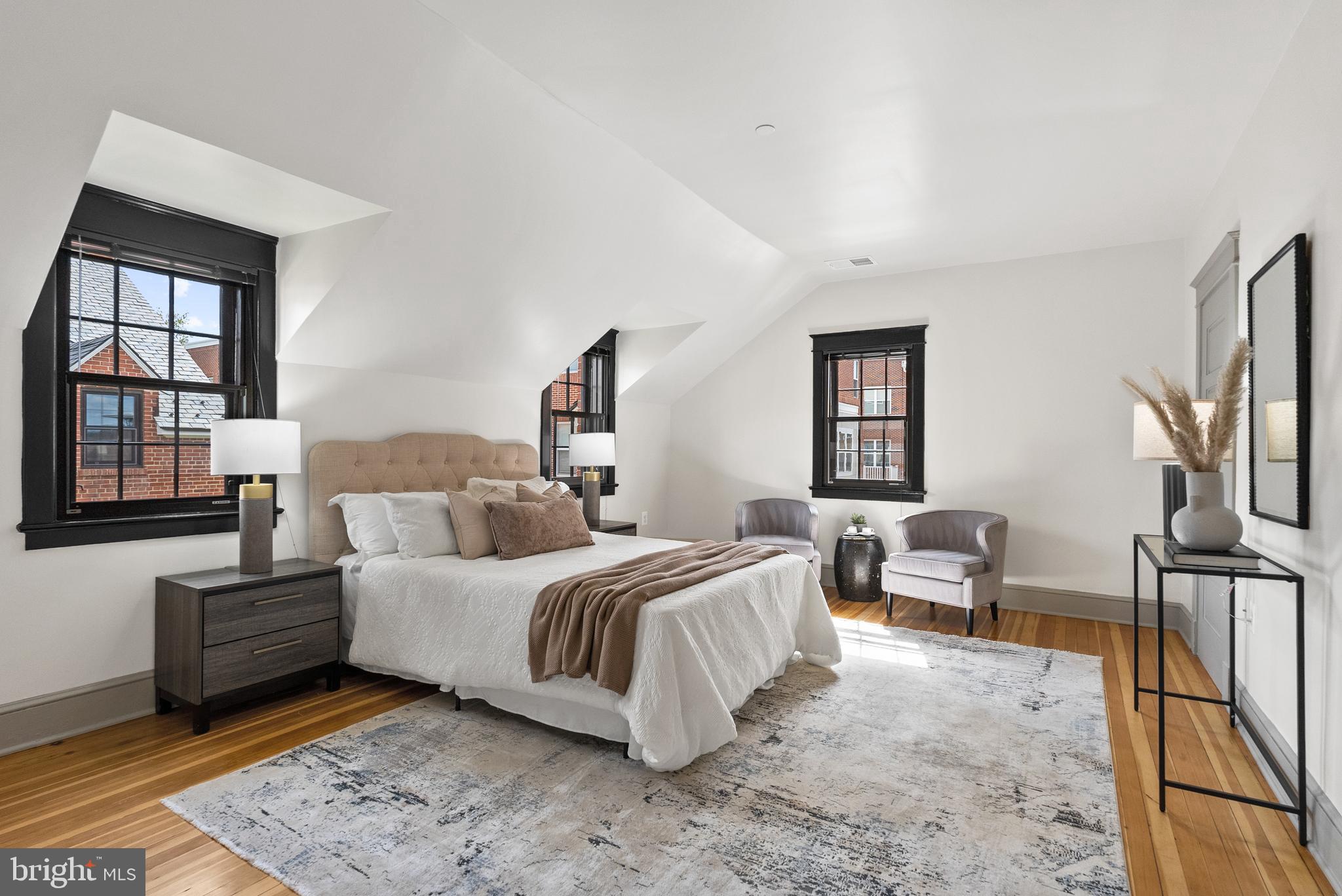 9071 Power House Road, Unit 102 Lorton, VA 22079 - Photo 31 of 53 a bedroom with bed and window