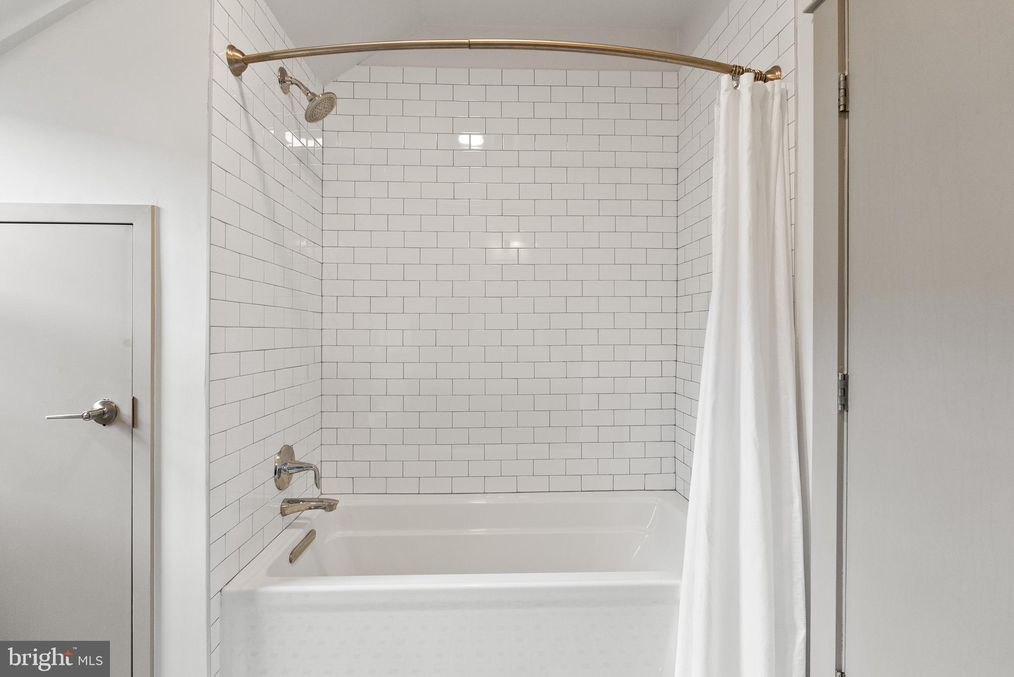 9071 Power House Road, Unit 102 Lorton, VA 22079 - Photo 35 of 53 a bathroom with a shower and a bath tub