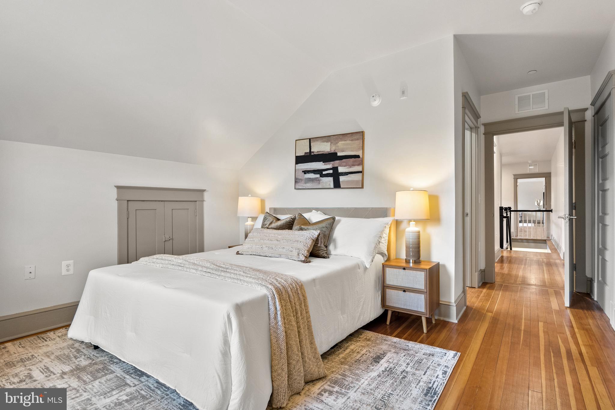 9071 Power House Road, Unit 102 Lorton, VA 22079 - Photo 37 of 53 a bedroom with a bed and wooden floor