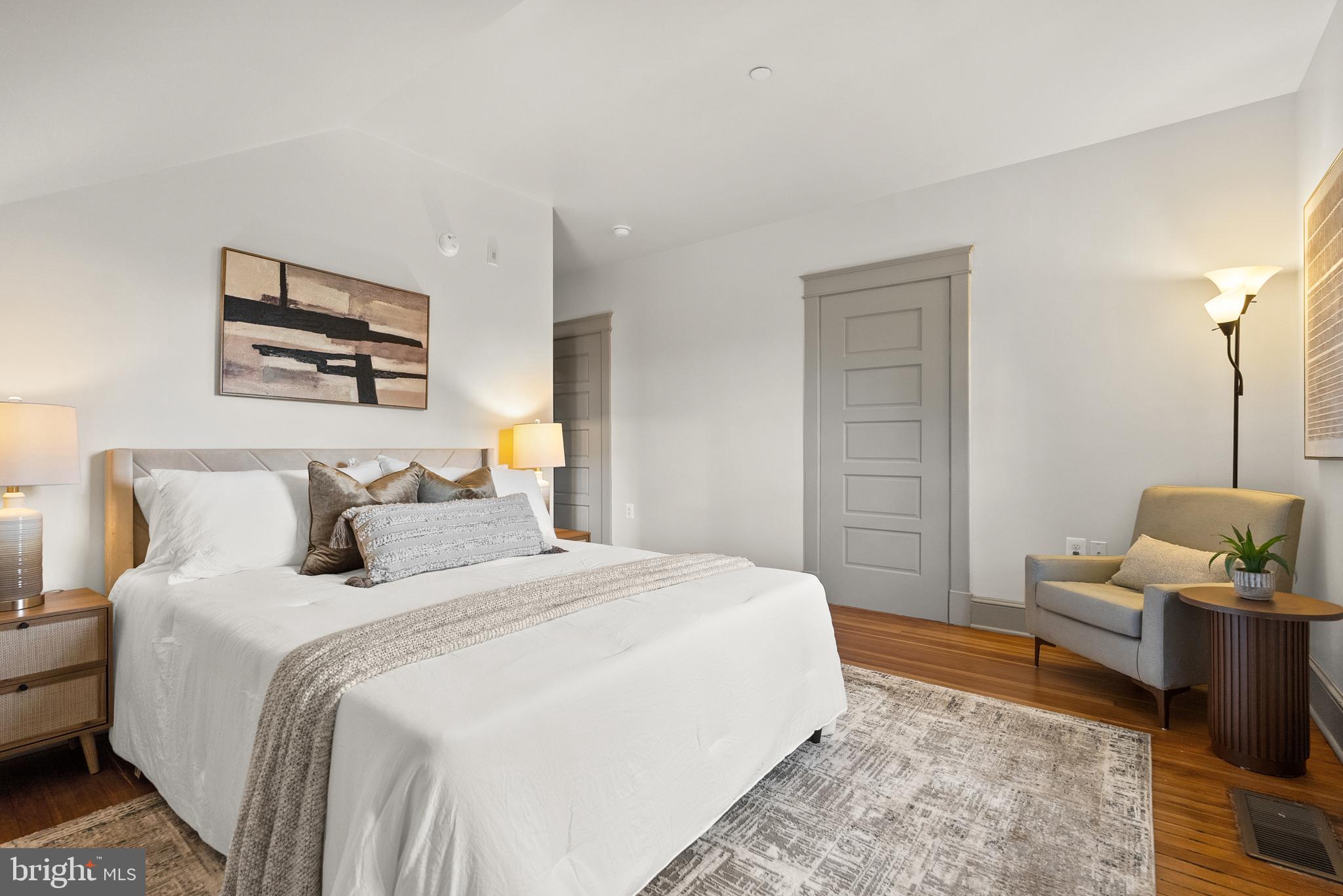 9071 Power House Road, Unit 102 Lorton, VA 22079 - Photo 38 of 53 a bedroom with a bed a couch and potted plant