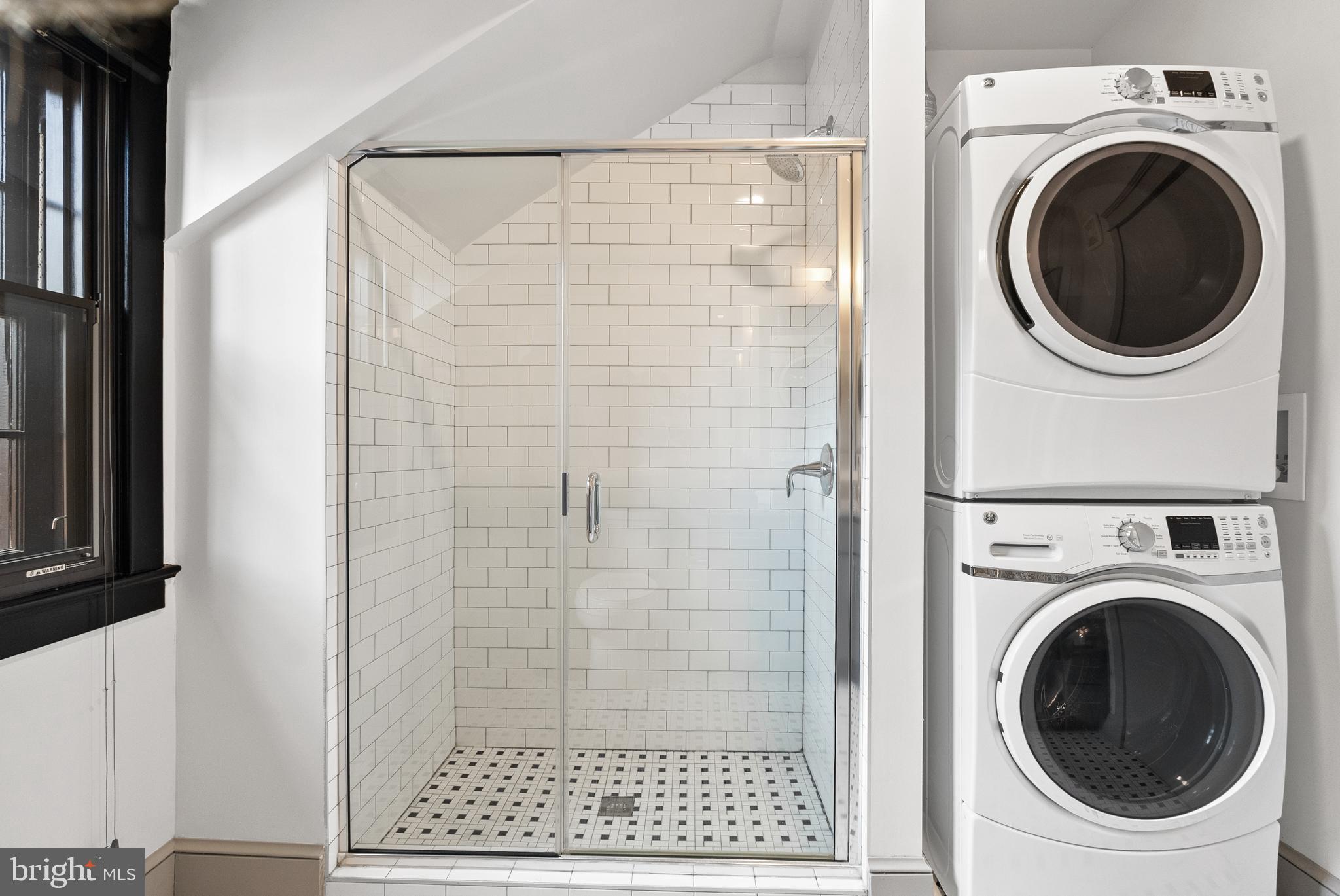 9071 Power House Road, Unit 102 Lorton, VA 22079 - Photo 41 of 53 a view of a bathroom with a washer and dryer