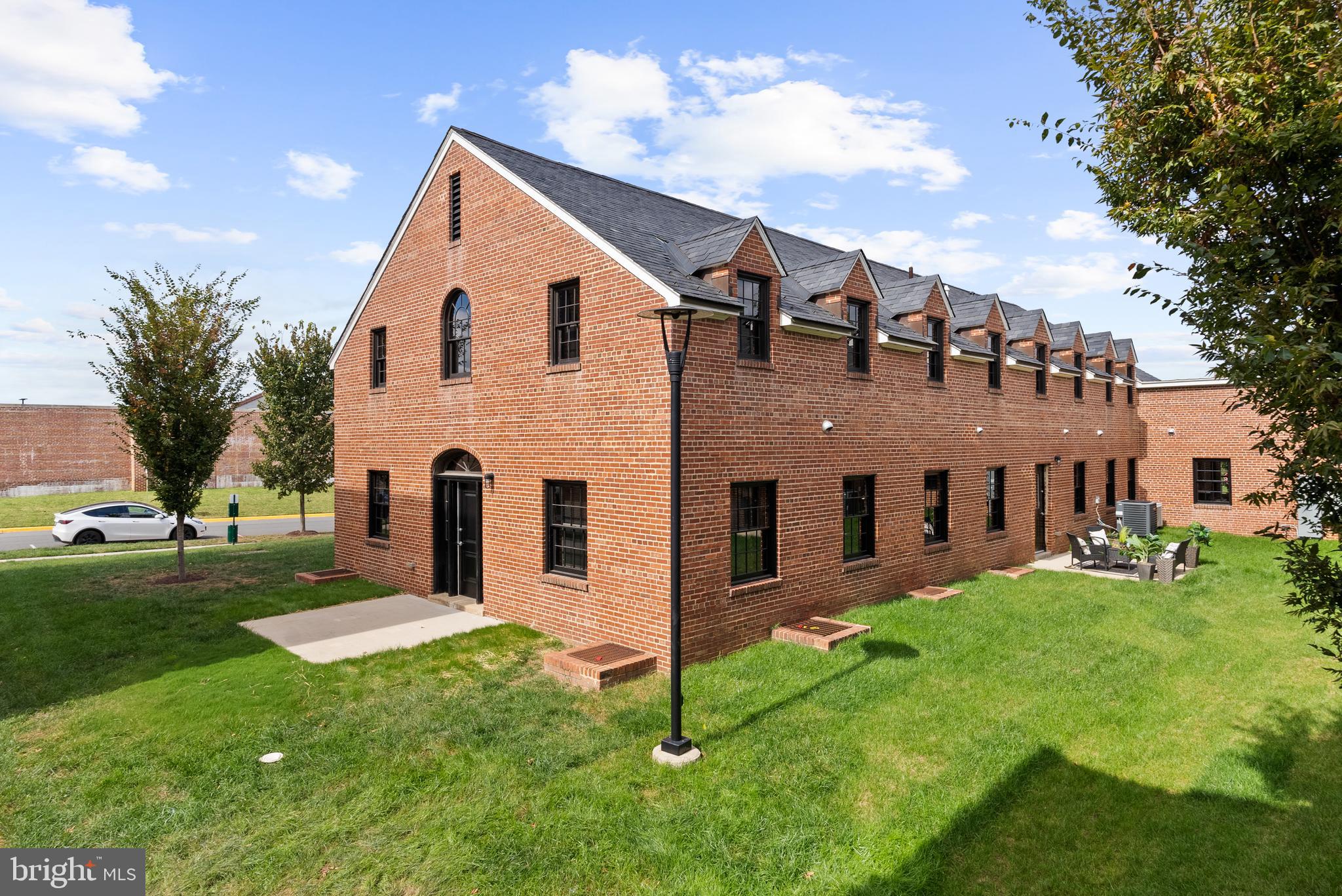 9071 Power House Road, Unit 102 Lorton, VA 22079 - Photo 42 of 53 a view of a house with a yard