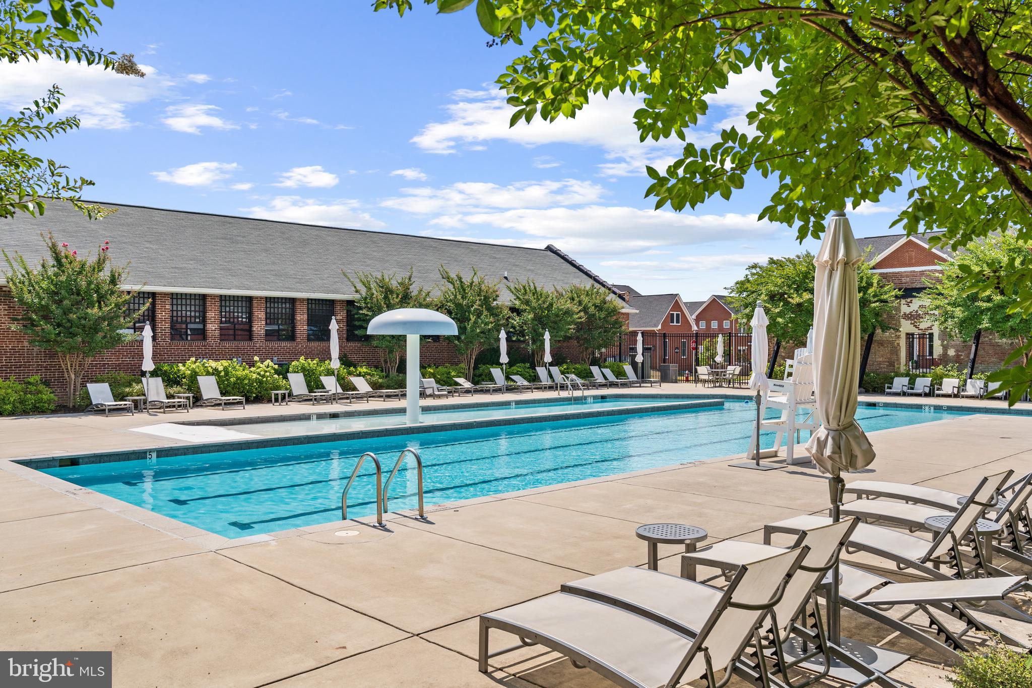 9071 Power House Road, Unit 102 Lorton, VA 22079 - Photo 43 of 53 a view of a patio with a table and chairs