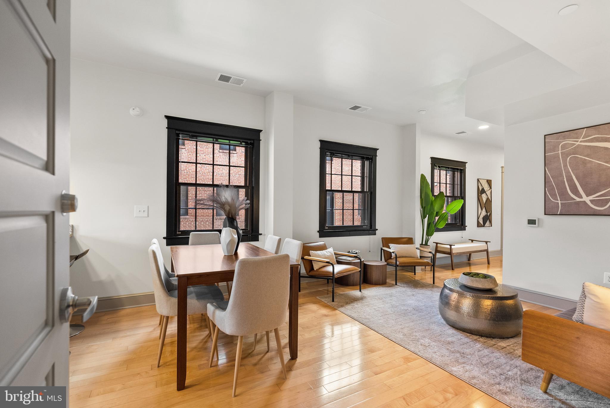 9071 Power House Road, Unit 102 Lorton, VA 22079 - Photo 6 of 53 a view of a dining room with furniture