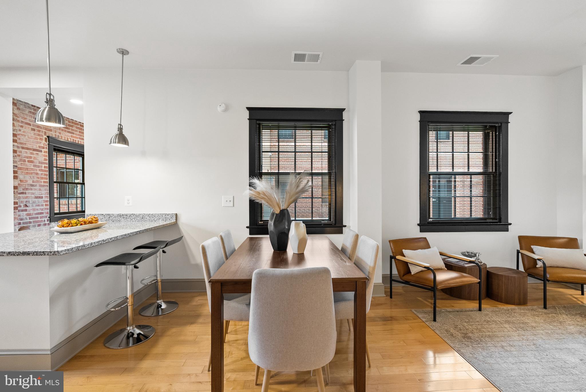 9071 Power House Road, Unit 102 Lorton, VA 22079 - Photo 7 of 53 a living room with furniture a window and a chandelier