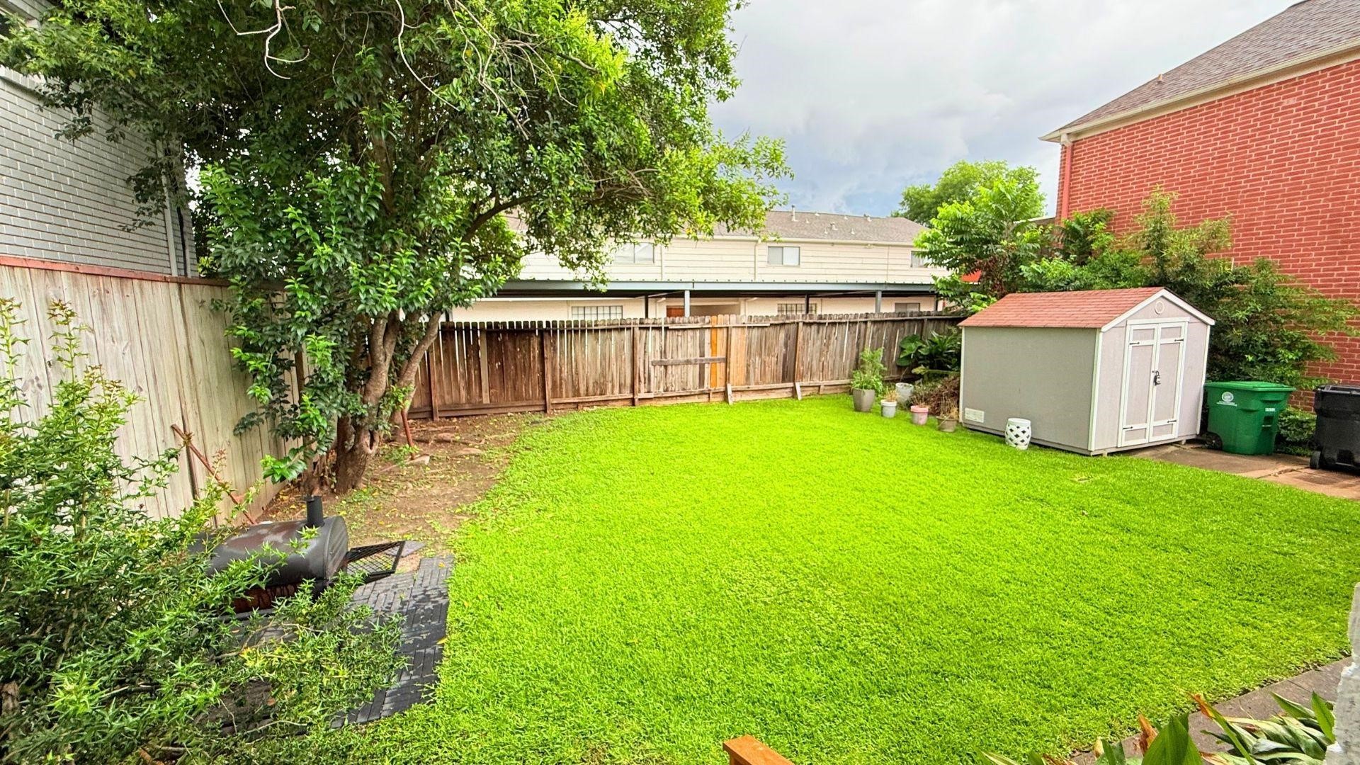 2220 Avalon Place Houston, TX 77019 - Photo 12 of 12 a view of a backyard with a garden and plants