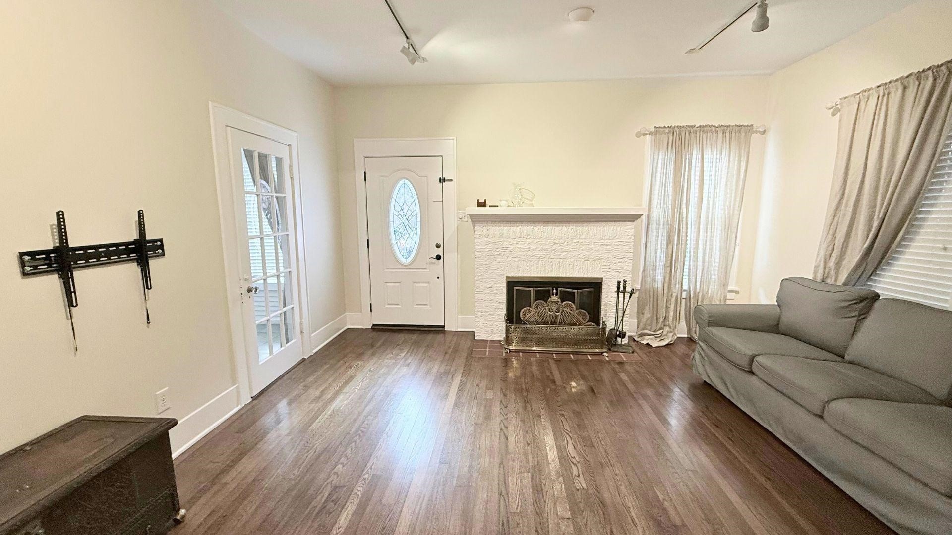 2220 Avalon Place Houston, TX 77019 - Photo 2 of 12 a living room with furniture and a fireplace