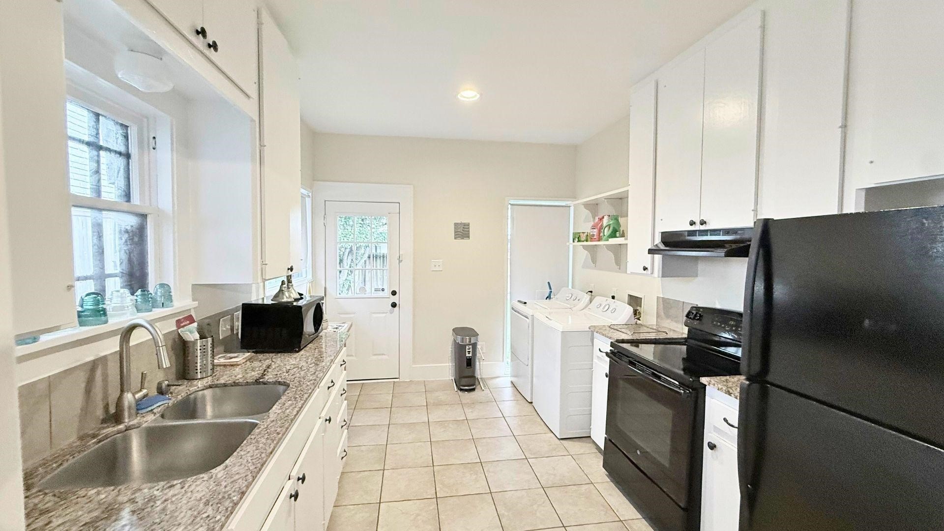 2220 Avalon Place Houston, TX 77019 - Photo 5 of 12 a kitchen with a sink stove and refrigerator
