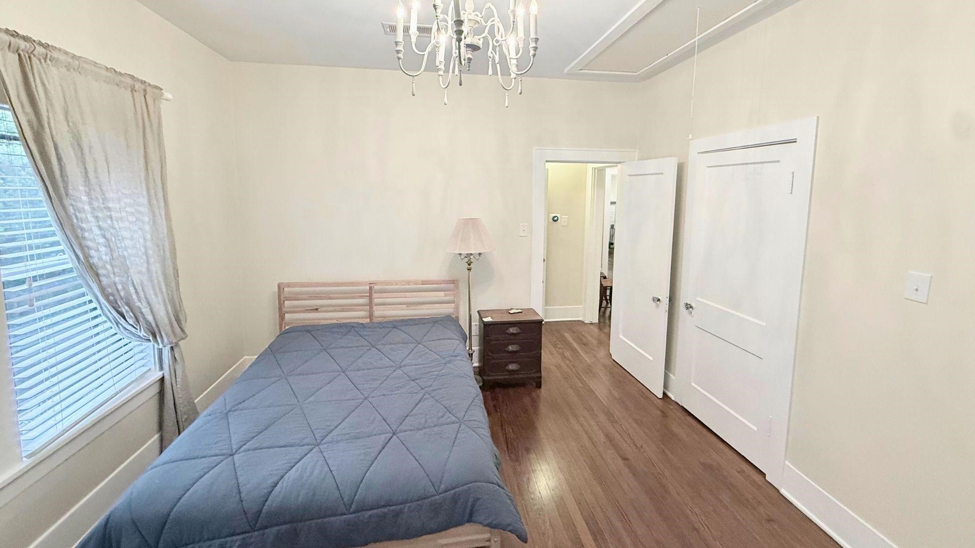2220 Avalon Place Houston, TX 77019 - Photo 6 of 12 a view of a hallway with wooden floor and staircase