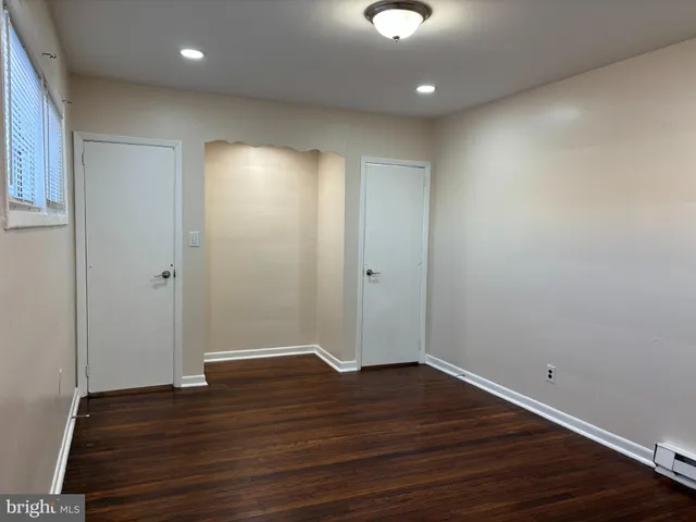 a view of room with hardwood floor
