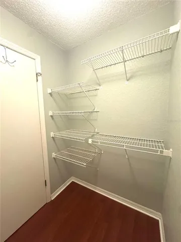 a view of a room with racks on the wall