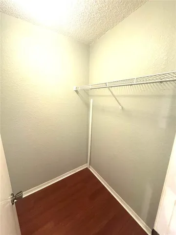 a view of a room with racks on the wall