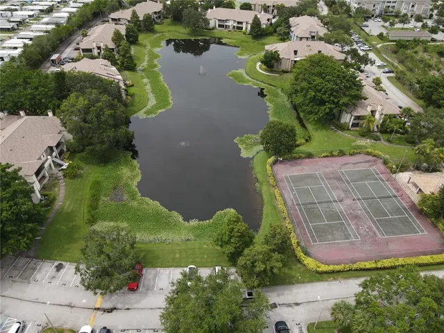 an aerial view of a house with yard swimming pool and outdoor seating
