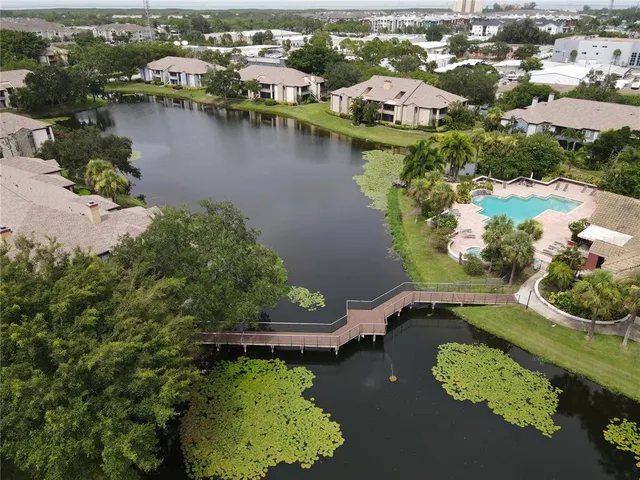 an aerial view of a house with a lake view