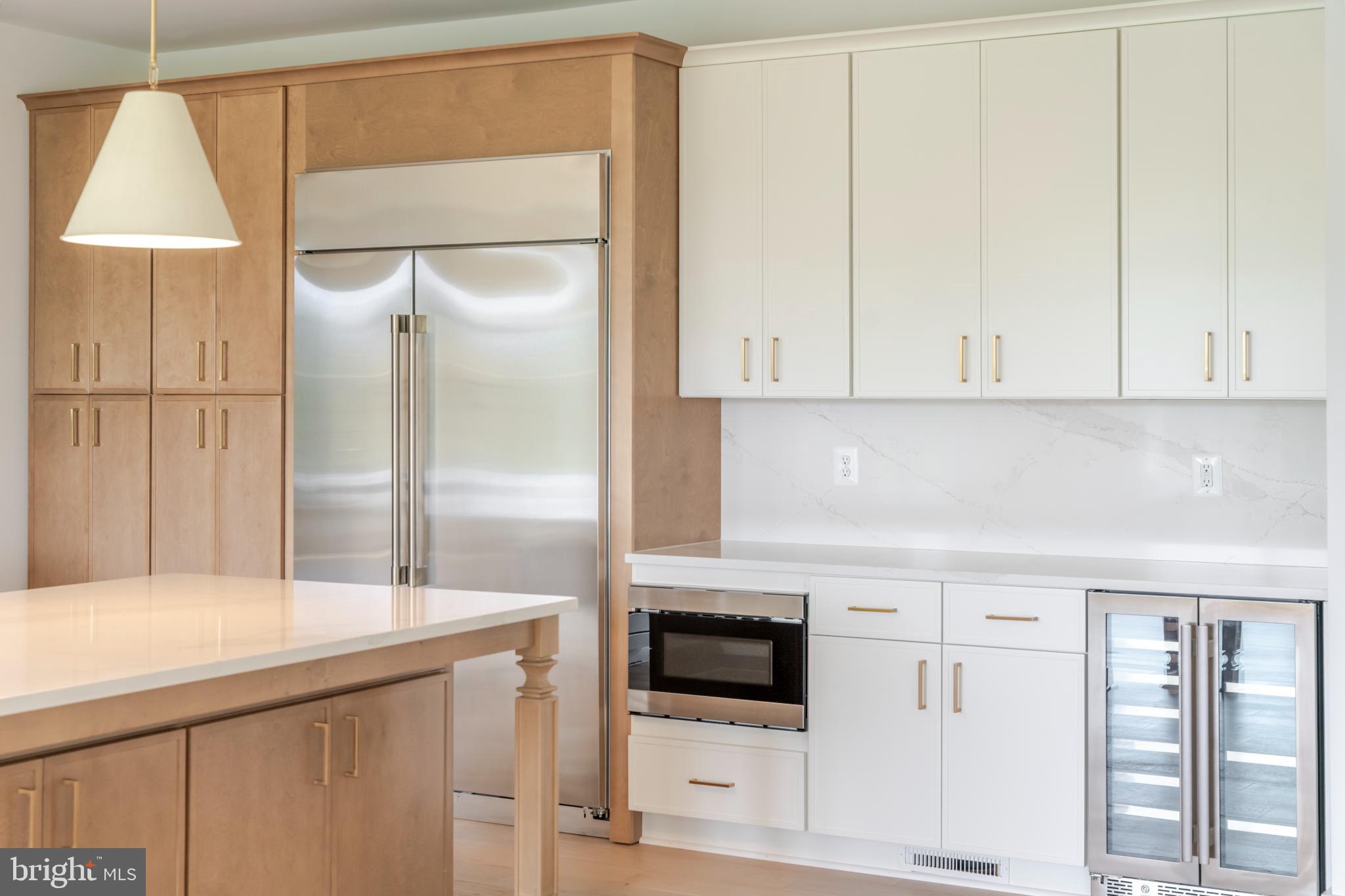 623 Traveller Court Lothian, MD 20711 - Photo 13 of 76 Sleek modern kitchen with elegant finishes.