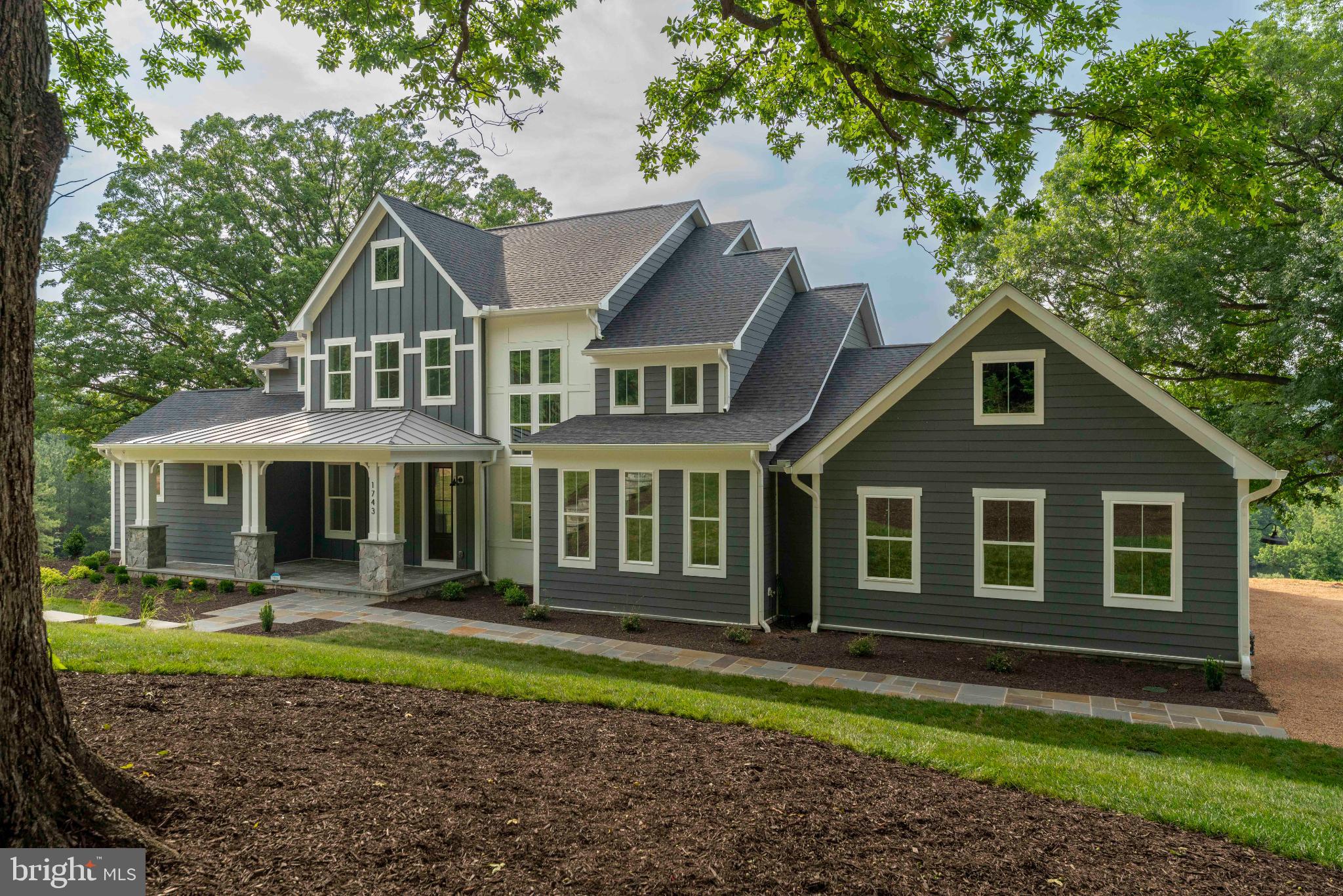 623 Traveller Court Lothian, MD 20711 - Photo 2 of 76 Charming modern home nestled in lush greenery.