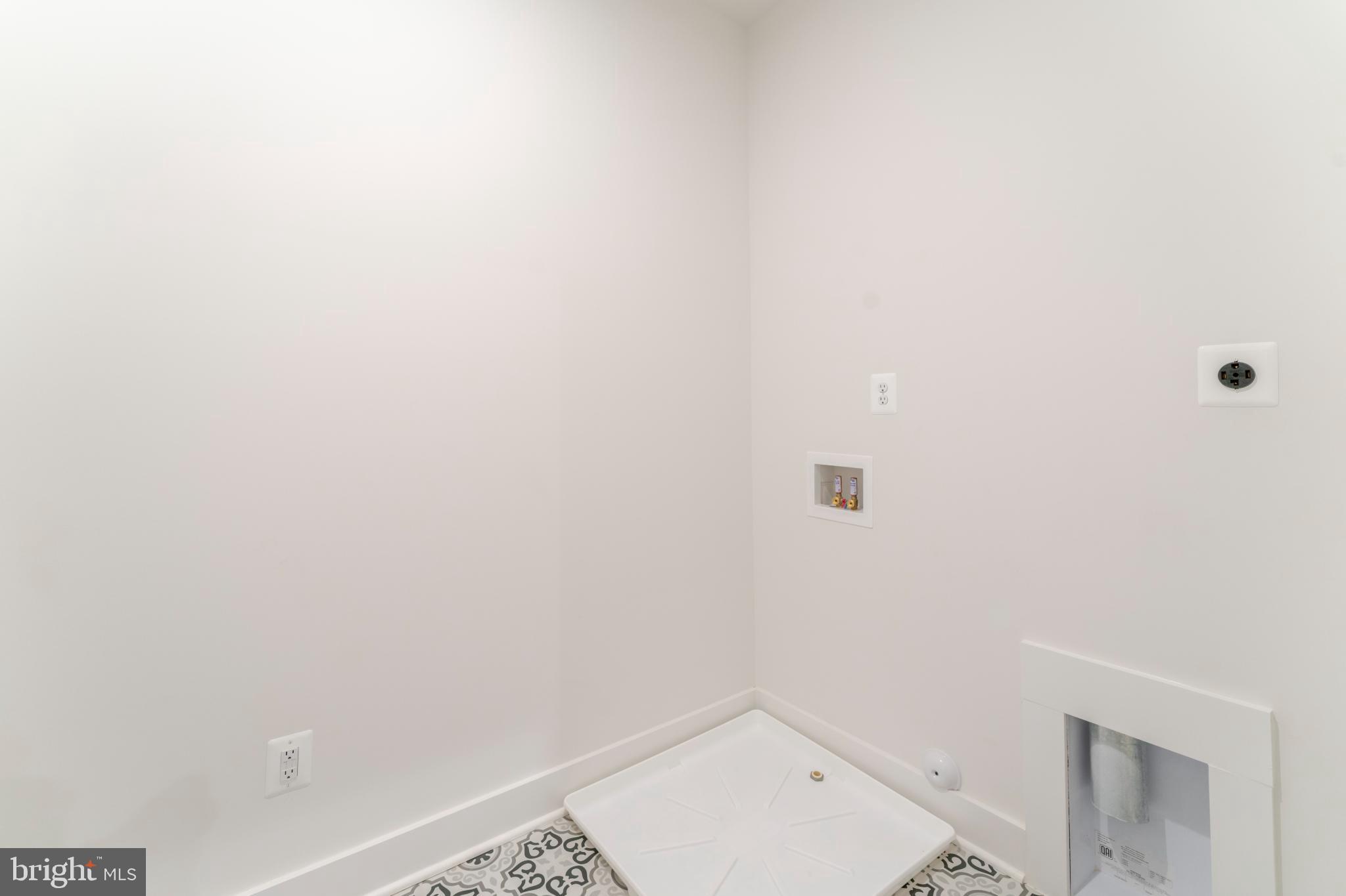 623 Traveller Court Lothian, MD 20711 - Photo 33 of 76 Bright and airy laundry space awaits creativity.