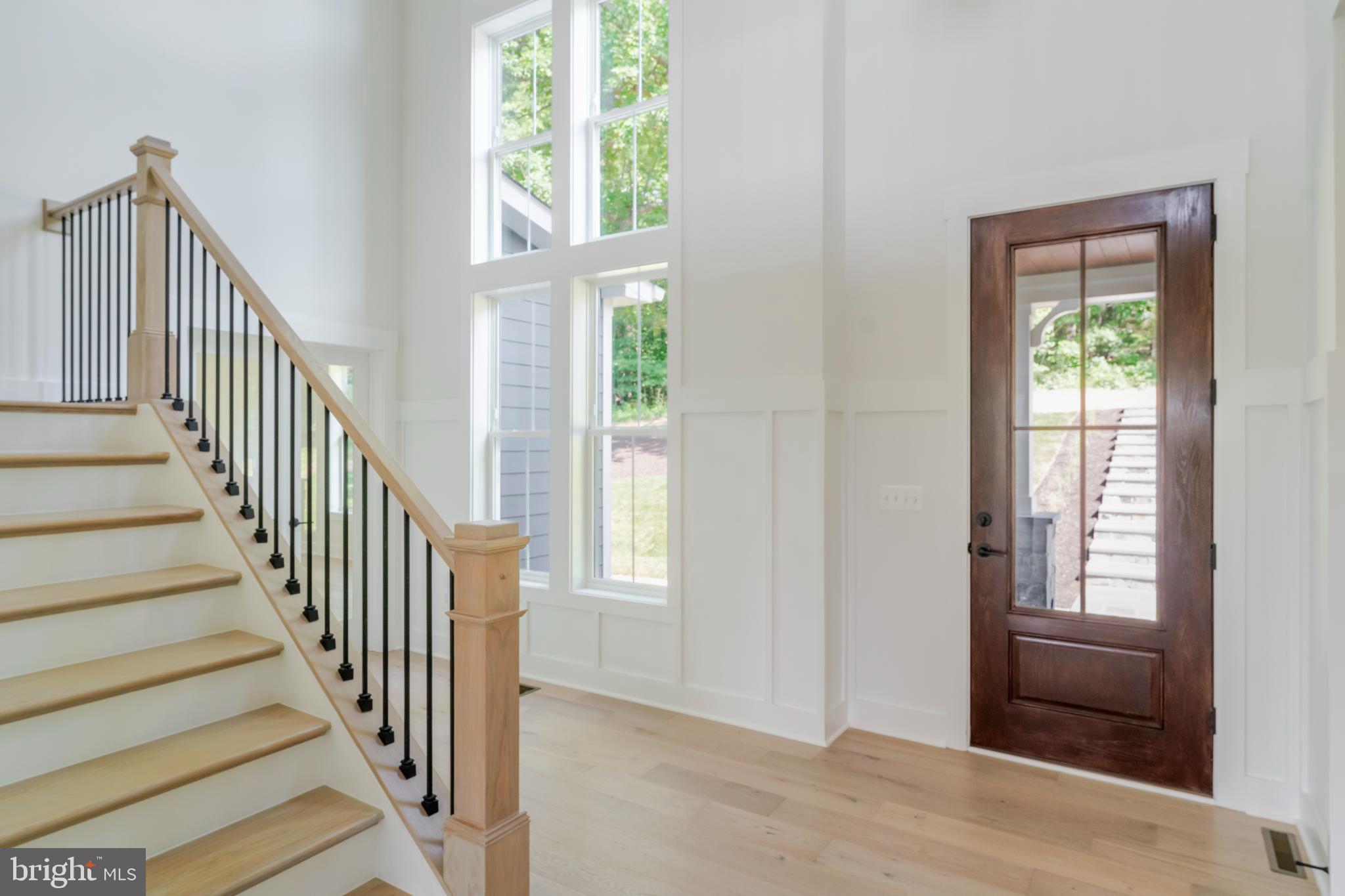 623 Traveller Court Lothian, MD 20711 - Photo 4 of 76 Bright entryway with elegant staircase.