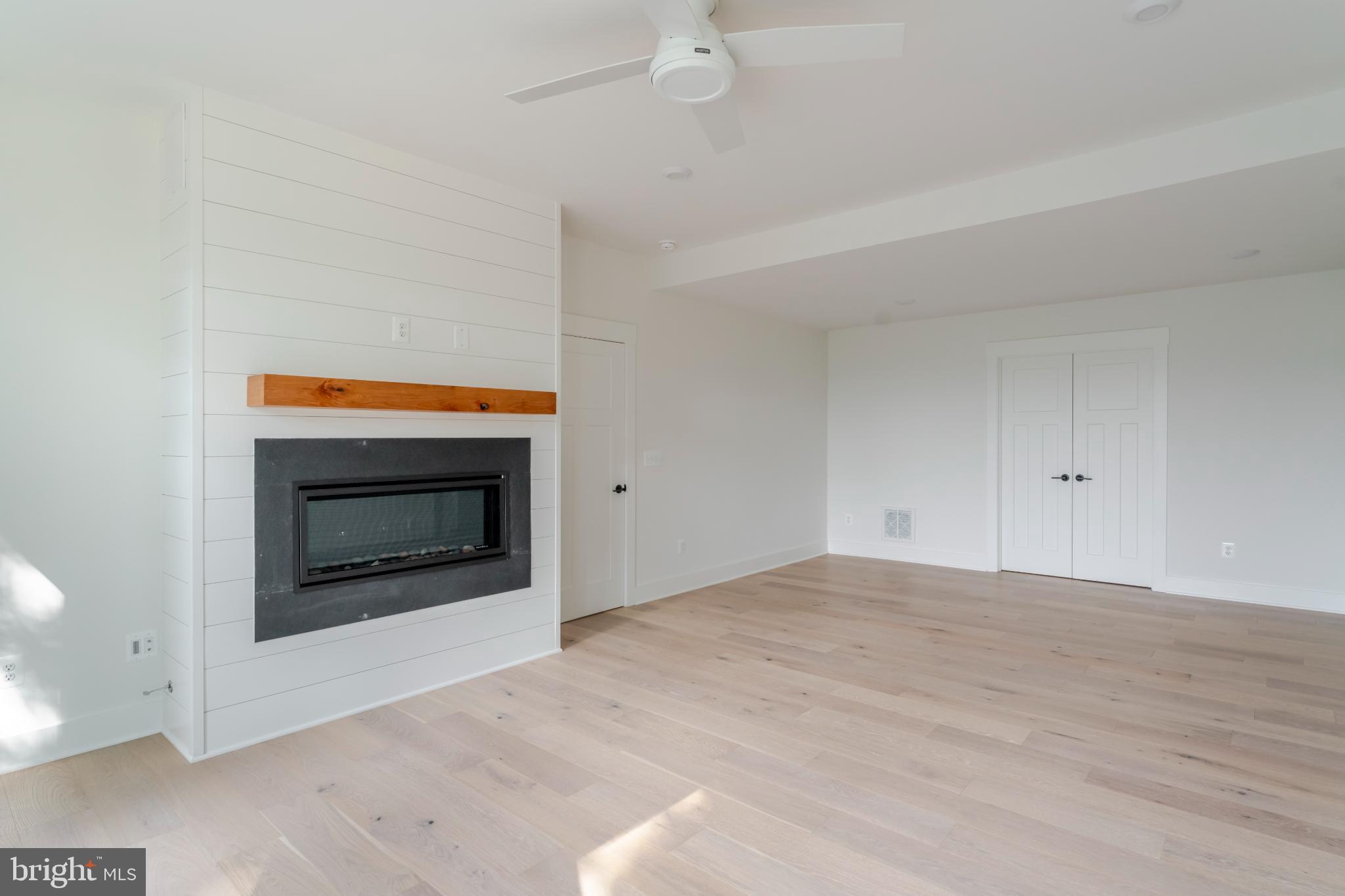 623 Traveller Court Lothian, MD 20711 - Photo 44 of 76 Bright, airy space with modern fireplace.