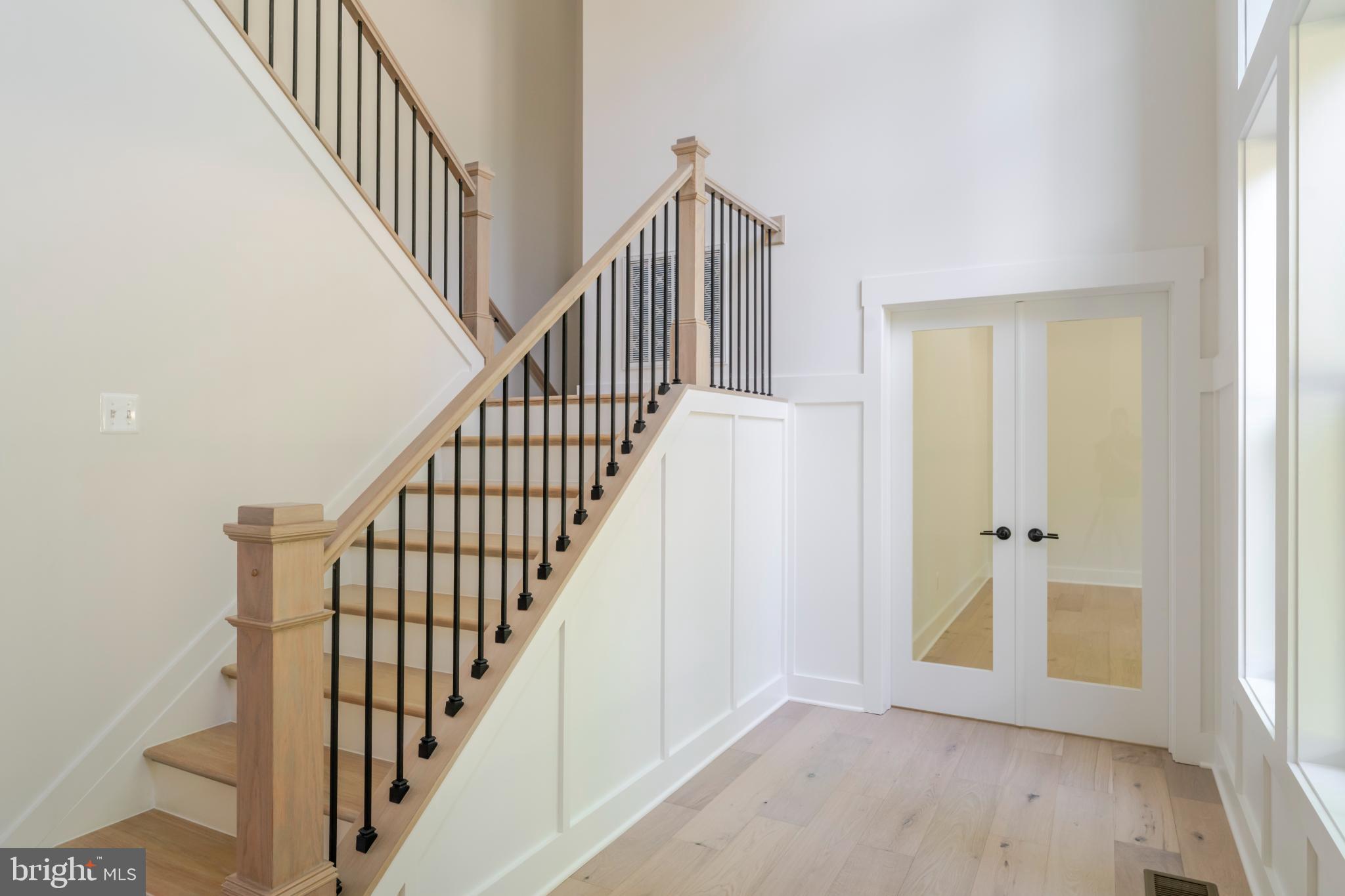 623 Traveller Court Lothian, MD 20711 - Photo 5 of 76 Elegant entryway with modern staircase.