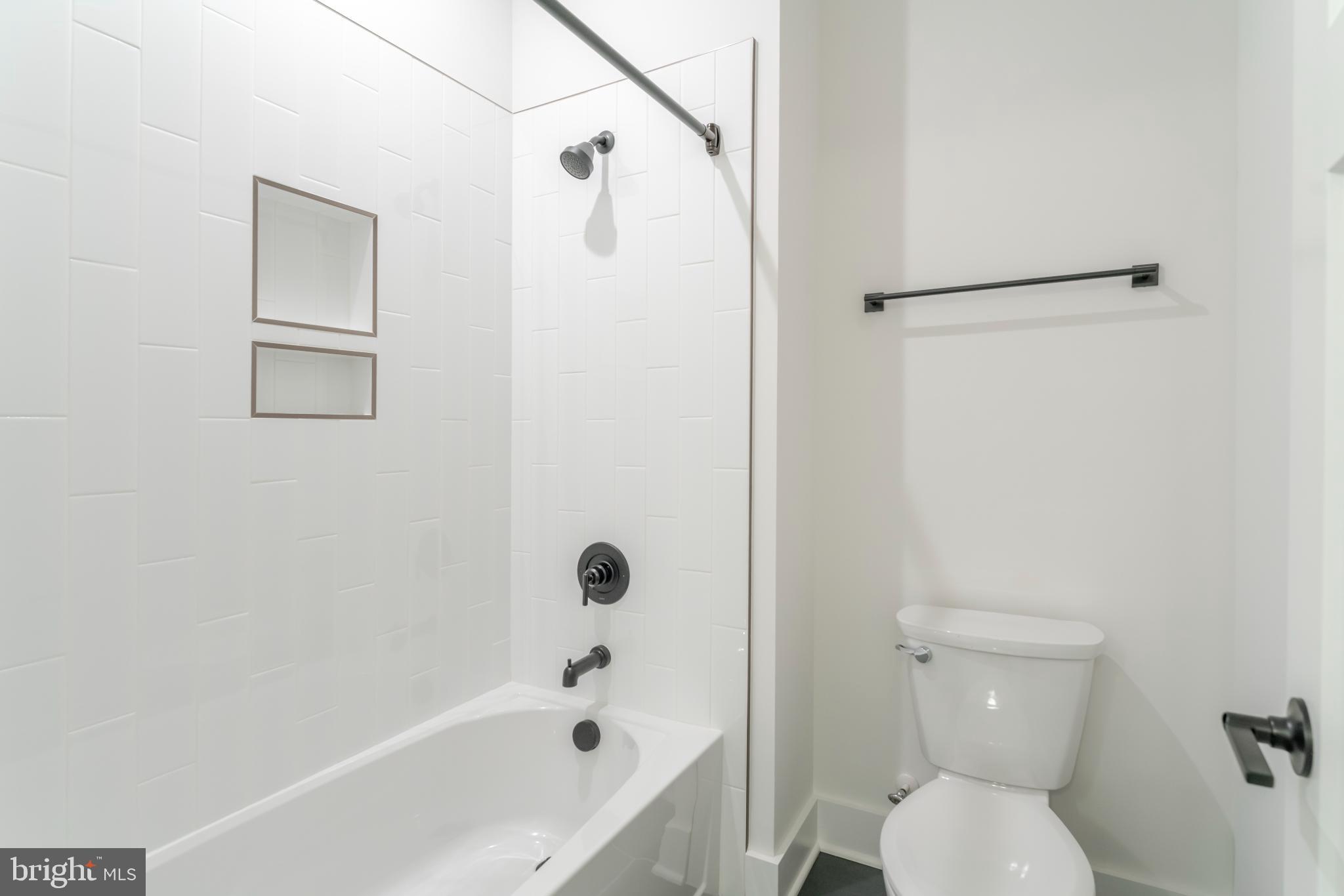 623 Traveller Court Lothian, MD 20711 - Photo 52 of 76 Sleek, modern bathroom with clean lines.