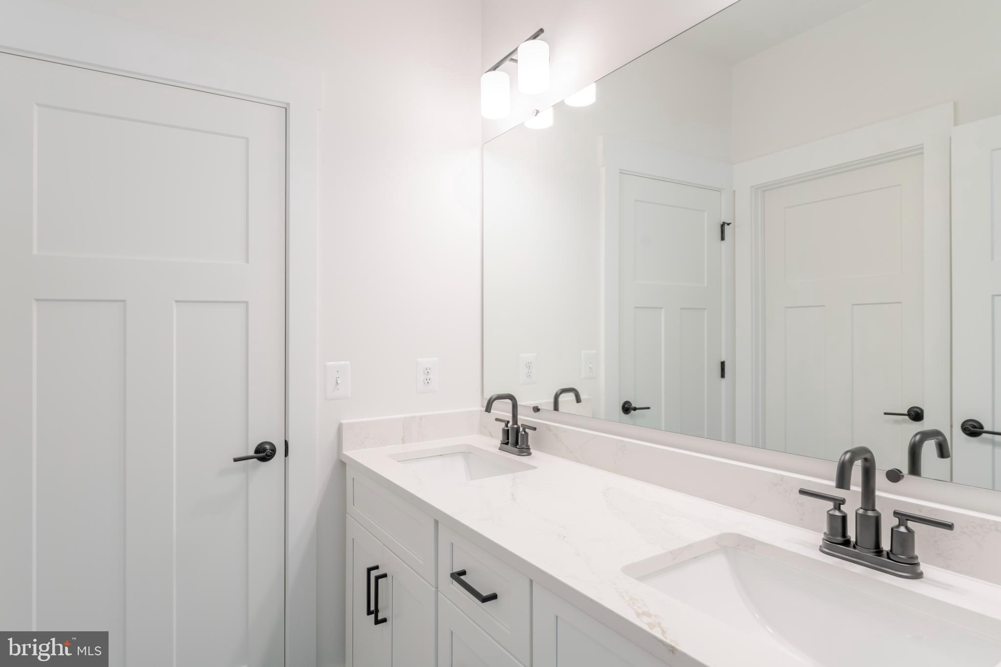 623 Traveller Court Lothian, MD 20711 - Photo 53 of 76 Sleek modern bathroom with elegant finishes.