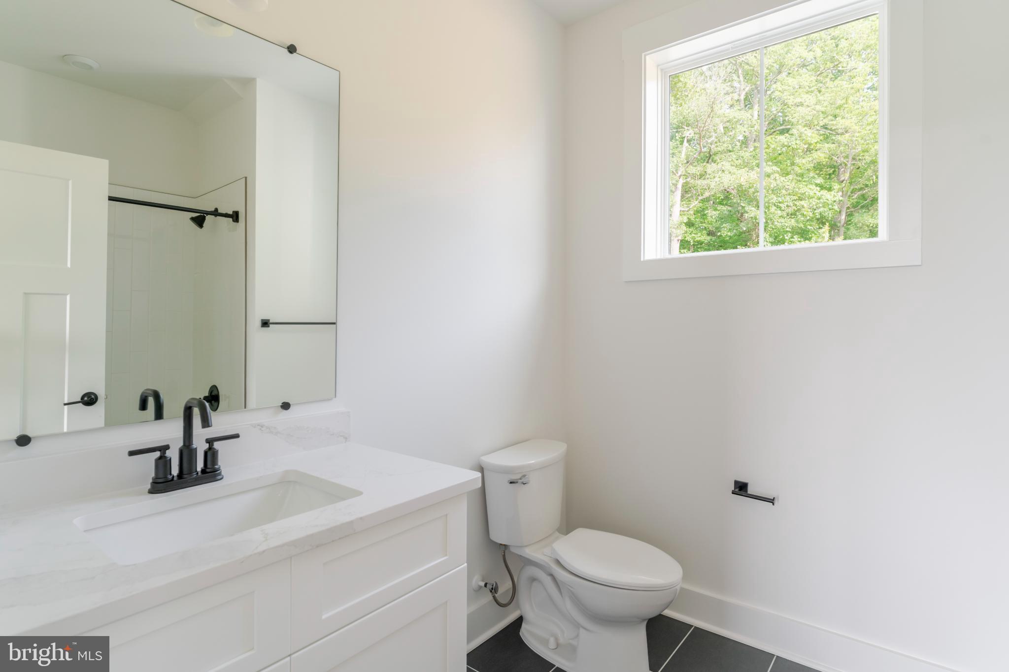 623 Traveller Court Lothian, MD 20711 - Photo 60 of 76 Modern bathroom with natural light.