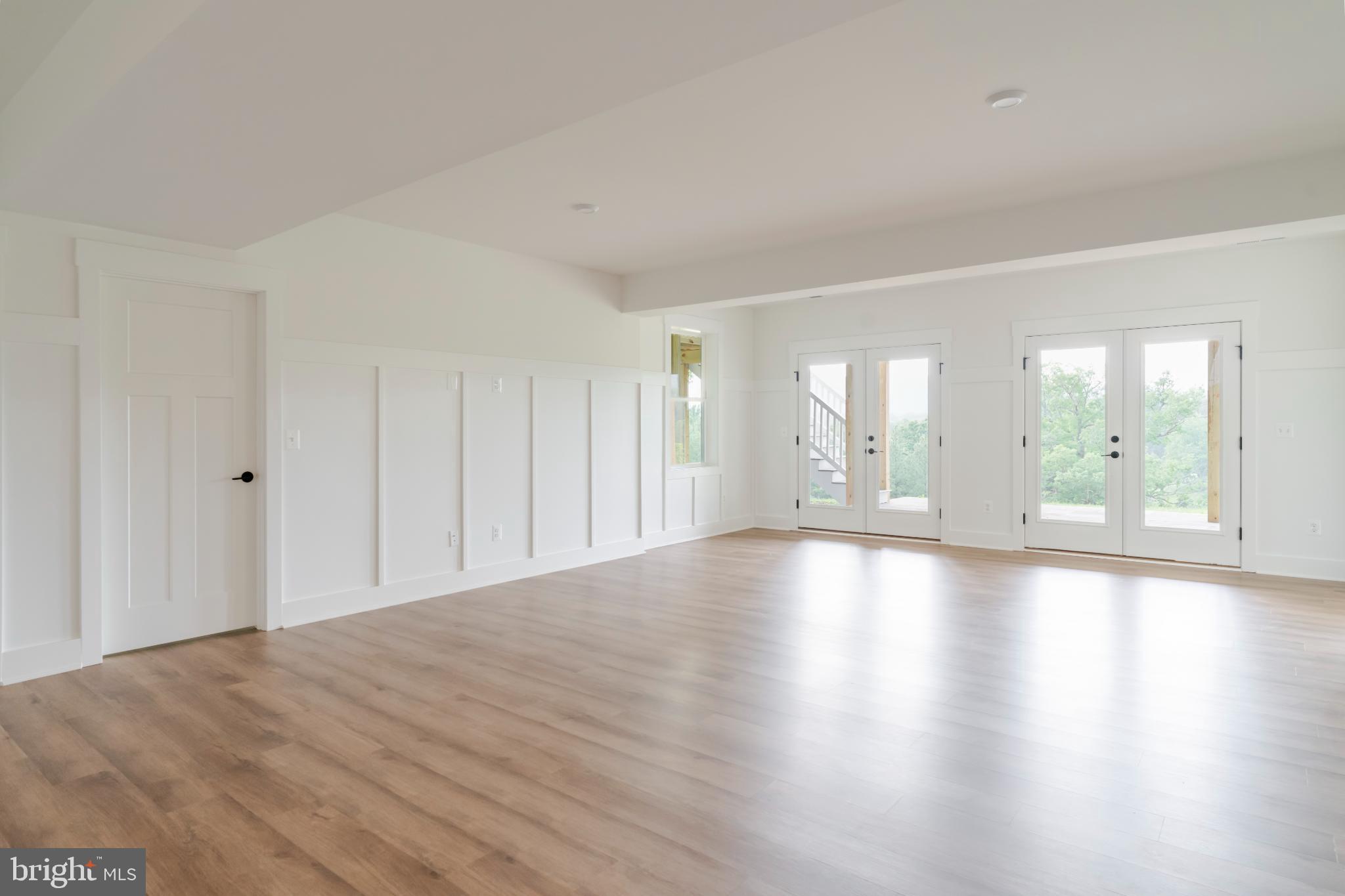 623 Traveller Court Lothian, MD 20711 - Photo 65 of 76 Spacious room with serene outdoor views.