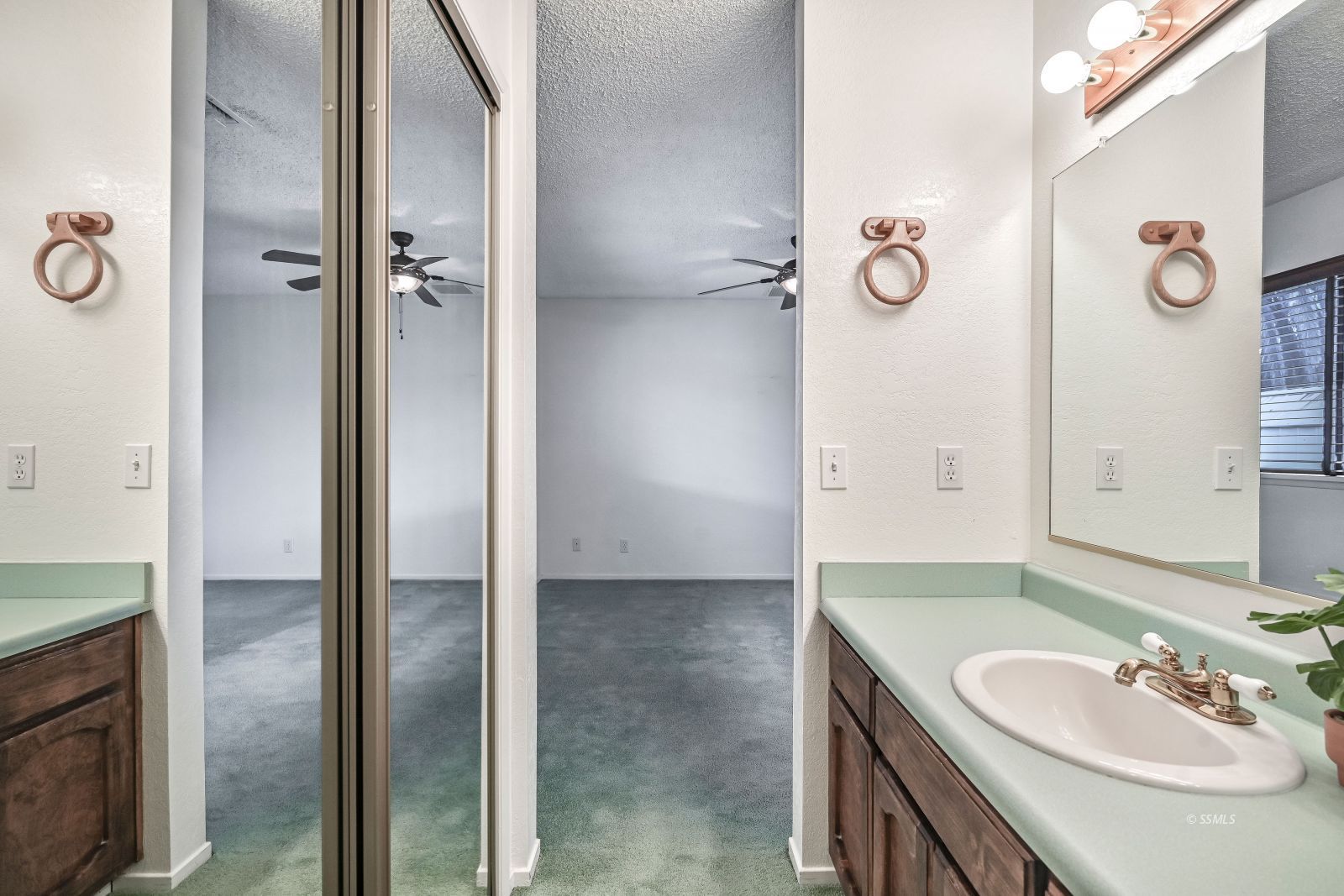 628 South Gemstone Street Ridgecrest, CA 93555 - Photo 18 of 24 a bathroom with a sink and a mirror