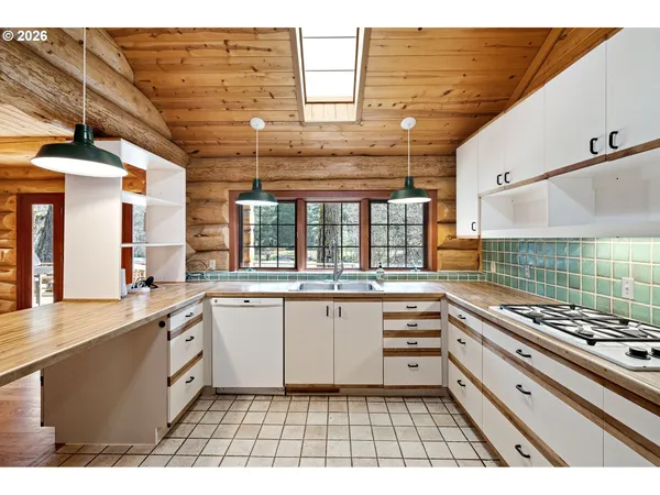 a large kitchen with a stove