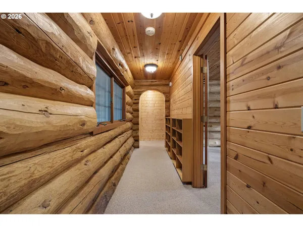 a view of a livingroom with wooden floor and window