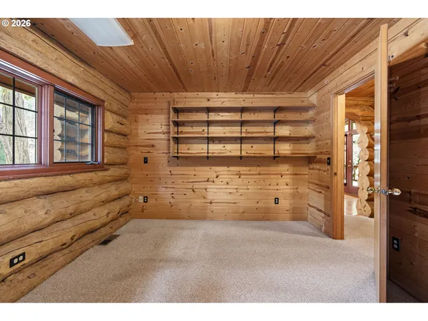 a view of a house with a wooden deck