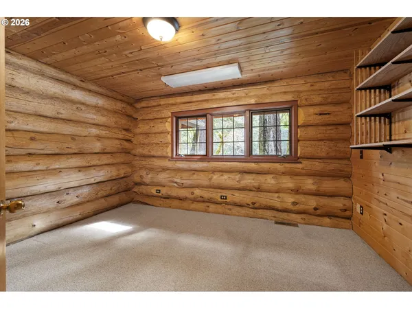 a view of an empty room with a balcony