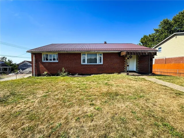 a view of house with yard