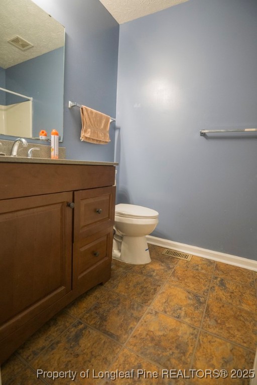 5014 Summer Ridge Road Fayetteville, NC 28303 - Photo 20 of 20 a bathroom with a toilet a sink and mirror